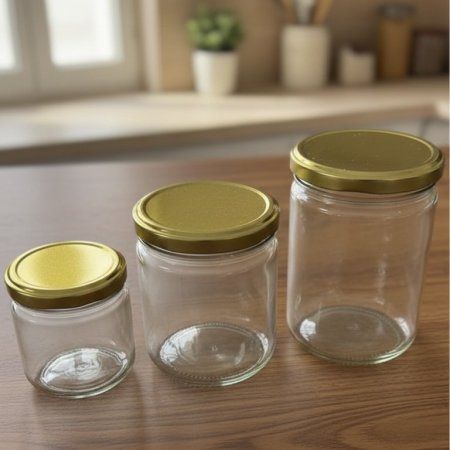 مرطبان زجاج شفاف مع غطاء معدني ذهبي