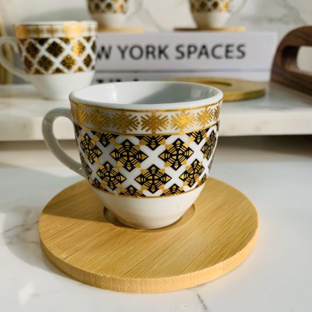 طقم فناجين بورسلان مع قاعدة خشبية 6 قطع ذهبي وأسود