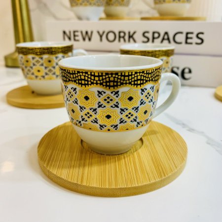 طقم 6 فناجين بورسلان مع قاعدة خشبية لون ذهبي وأسود