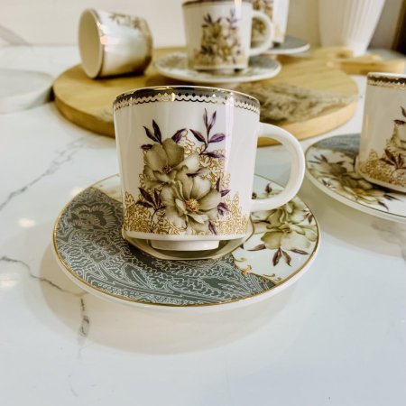 طقم 6 فناجين بورسلين + 6 صحون مورد مع حواف ذهبية